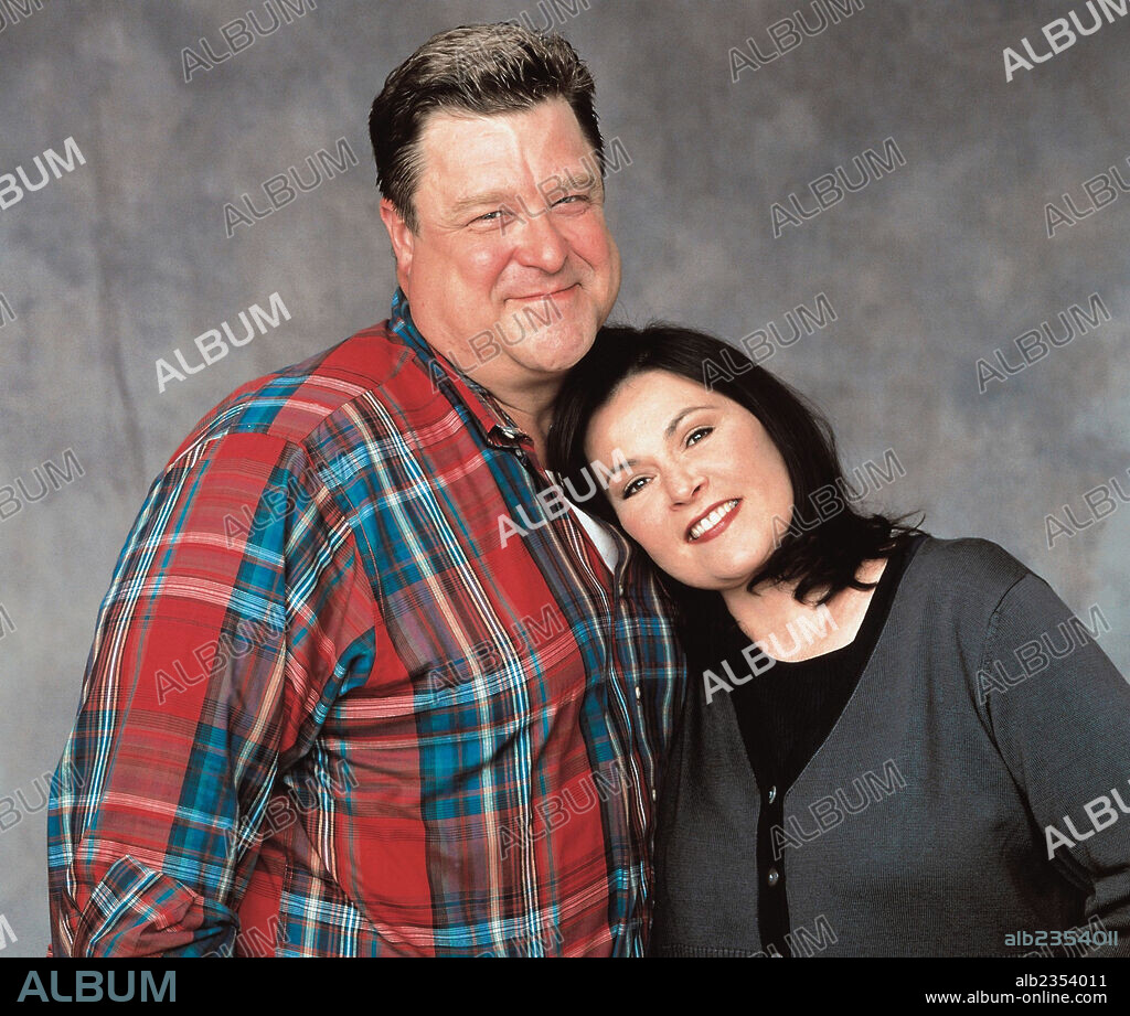 JOHN GOODMAN and ROSEANNE BARR in ROSEANNE, 1988. Copyright CASEY-WERNER CO./WIND DANCER PROD.