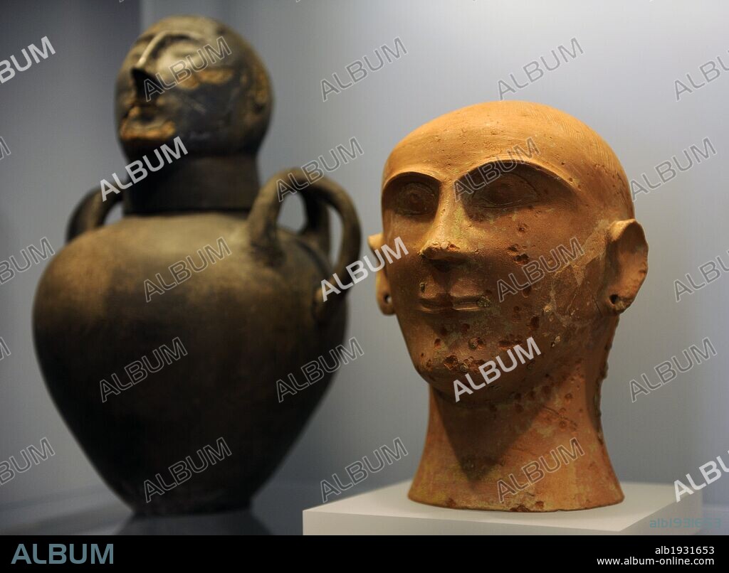 Etruscan Art. Italy. In honour of the ancestors. Symbolic faces were the focus and memorials held at the graveside. Symbolised Urns-face. Ny Carlsberg Glyptotek. Copenhage. Denmark..