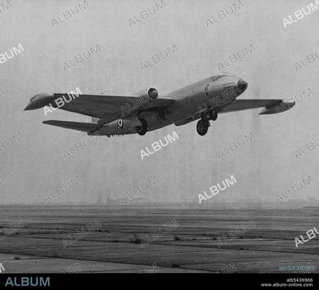 Canberra Tries For Two-Way Record -- The Canberra Bomber taking off London this morning. A Canberra medium jet bomber left London Airport today in an attempt to fly to New York and back in one day. At the controls was captain John Hackett, former RAF coastal command pilot. With him was Mr. Peter Moneypenny, 31-year-old Navigator. The two men already set up 15 unofficial Canberra records together. They hope to reach New York in seven-and-half, hours and to be back in London by teno's clock tonigh.