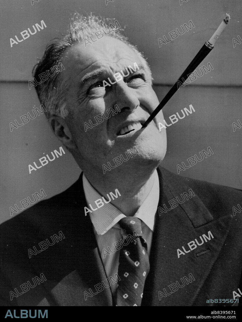 Roosevelt Portrayer Sails For England -- Godfrey Tearle, 61-year-old British actor approved by Mrs. Franklin D. Roosevelt to portray the late President in a motion picture about the Atom Bombs, puffs at a cigarette in a long holder on board the liner Queen Mary in New York, July 28, before sailing for England.Mr. Tearle is a brother of the Late Conway Tearle, Matinee  idol of the silent screen. July 28, 1946. (Photo by Associated Press Photo).