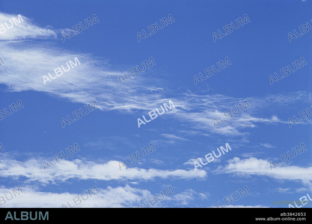 Cirrocumulus, fibratus and floccus clouds. High altitude.