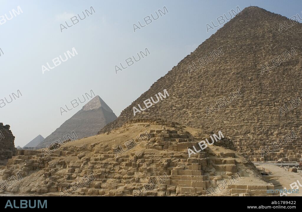 Egypt. The pyramid of Hetepheres I, G 1-a, with the Pyramid of Khufu (Cheops) and Khafre (Chephren) at the background. 26th century B.C. Old Kingdom.