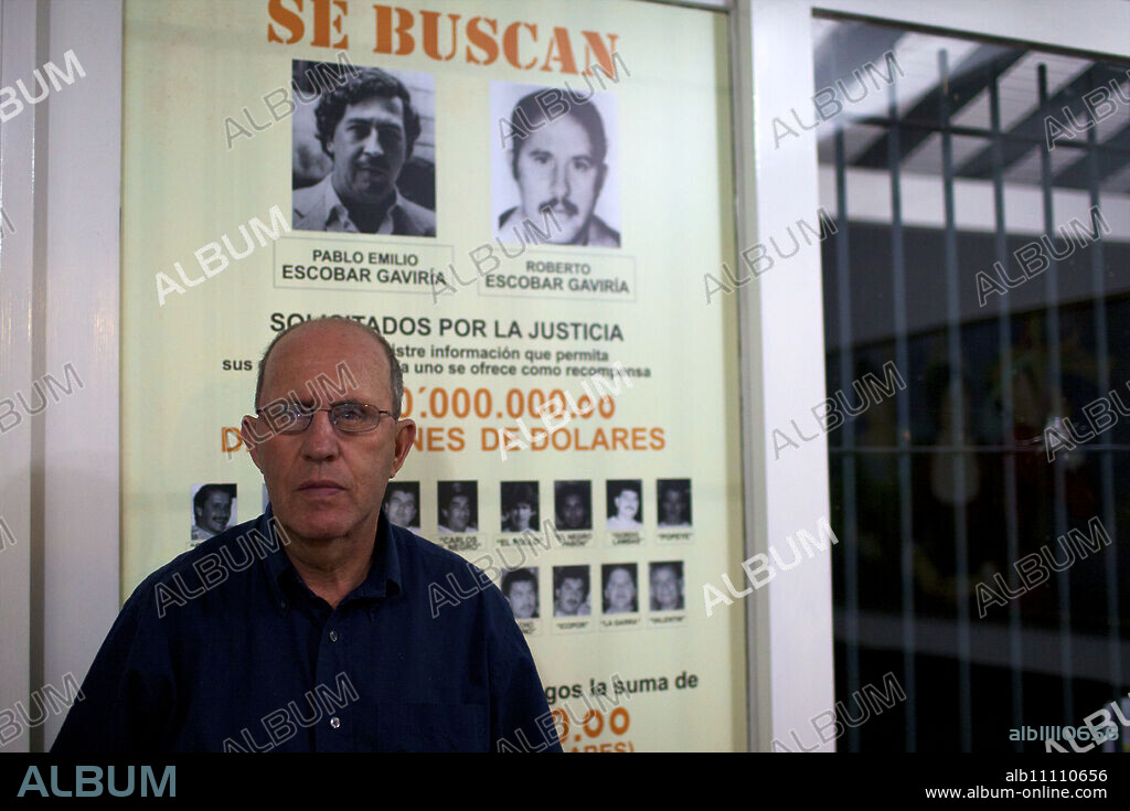 Roberto Escobar in his home of Medellin, under the panel offering 2 millions American dollars for his own capture, Colombia, South America.
