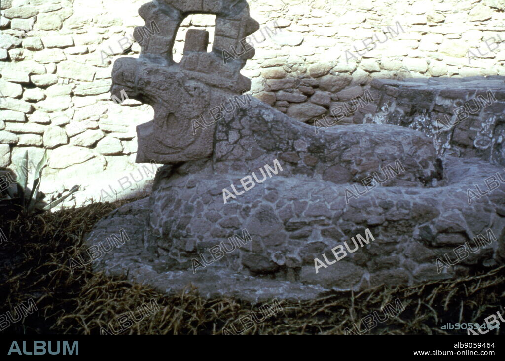 Pyramid wall with relief of Xiuhcoatl the Aztec Serpent God of the Sun. The relief at Tenayuca forms part of a pre-Columbian, Mesoamerican archaeological site in the Valley of Mexico. In the Post classic period of Mesoamerican chronology. By some historiographic traditions Tenayuca had been founded ca. 1224 by Xolotl, a semi-legendary ruler of a "Chichimec" tribe. Aztec temple architecture primarily developed at Tenayuca, which has the earliest example yet found of the typical Aztec double pyramid, which consists of joined pyramidal bases supporting two temples. The base of the Aztec pyramid of Tenayuca is adorned with a row of rattlesnake sculptures, known as coatepantli in Nahuatl.