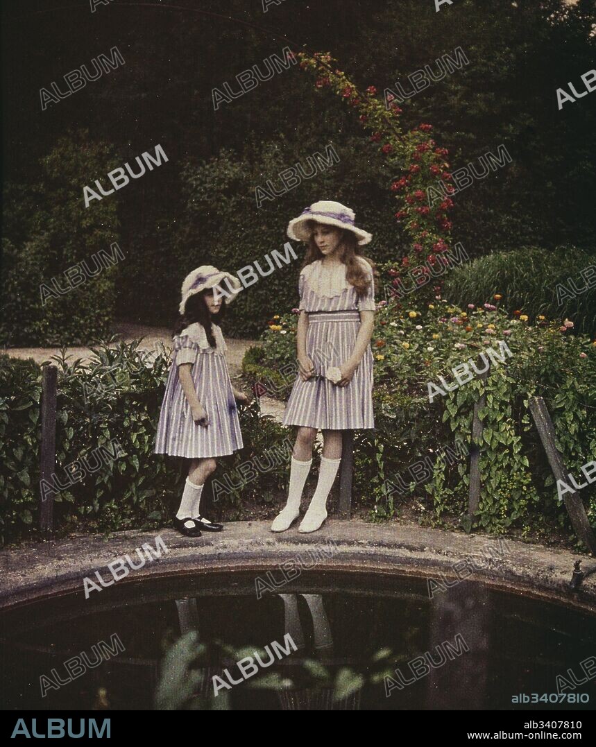 Two girls in a garden, 1908. photographed in Autochrome Lumière, an early colour photography process. Patented in 1903 by the Lumière brothers in France and first marketed in 1907, it was the principal colour photography process in use before the advent of subtractive colour film in the mid-1930s.