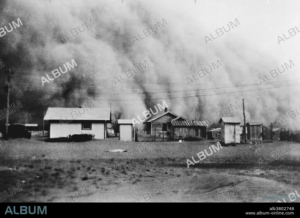 Huge dust storm hits Kansas during the Dust Bowl, an agricultural, ecological, and economic disaster in the Great Plains region of North America in the 1930s.