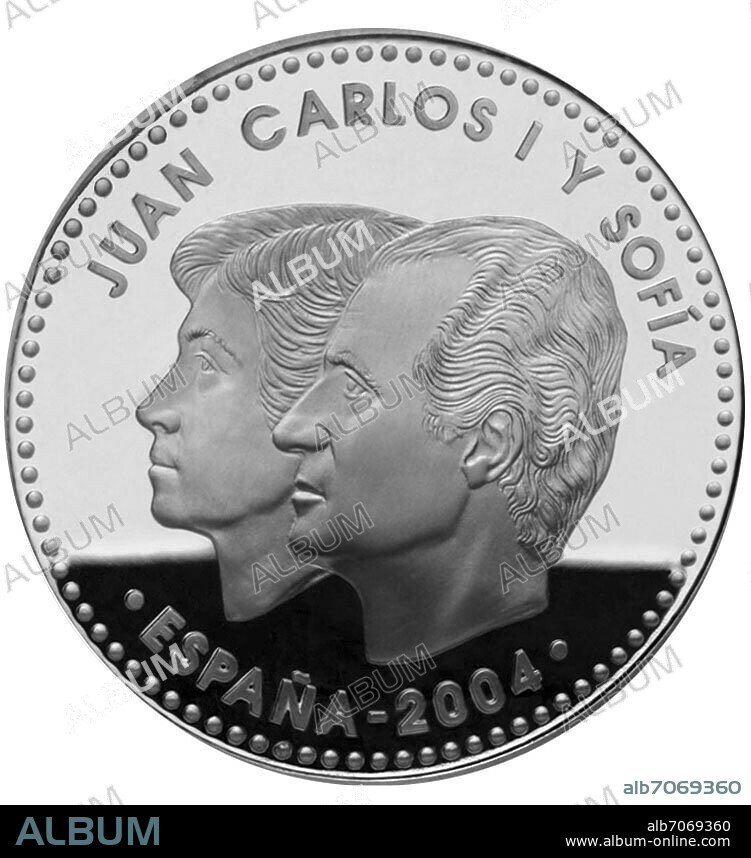 ANVERSO DE UNA MONEDA DE DOCE EUROS ACUÑADA EN PLATA DE LEY CON LA EFIGIE DE LOS REYES DE ESPAÑA DON JUAN CARLOS Y DOÑA SOFIA - 33 mm.