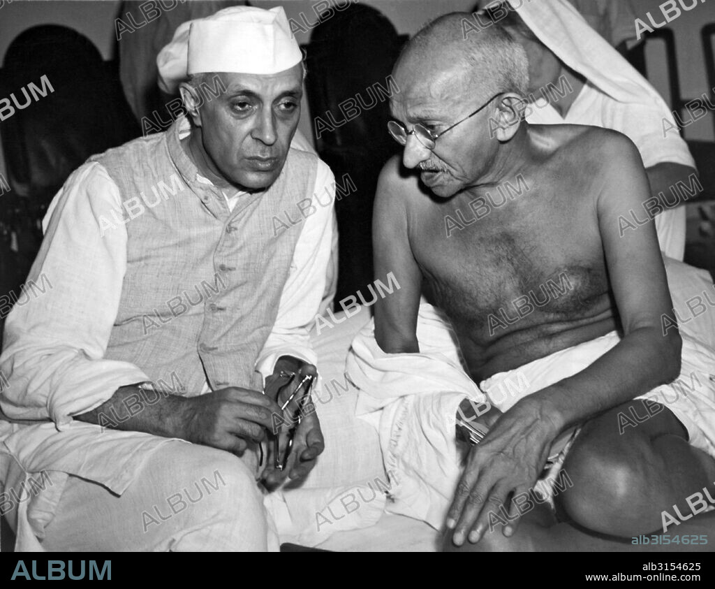 Bombay, India:  July 15, 1946 jawaharlal Nehru, the newly elected President of the All India Congress, talking with Mahatma Gandhi, Indian political strong man, at a meeting of the Congress.