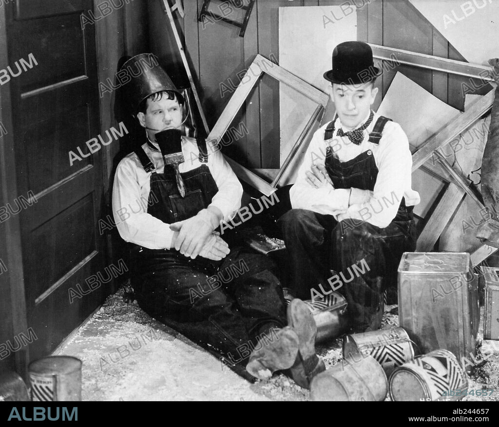 OLIVER HARDY and STAN LAUREL in BUSY BODIES, 1933, directed by LLOYD FRENCH. Copyright HAL ROACH/MGM.