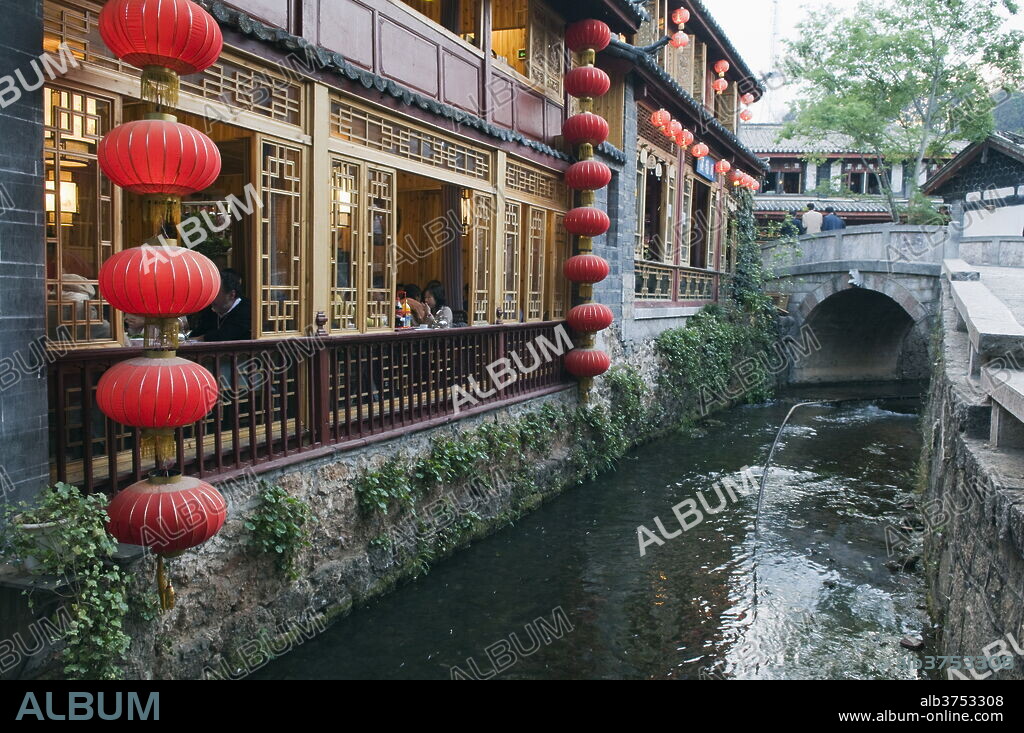 Traditional architecture of riverside restaurant in Lijiang Old Town, Lijiang, UNESCO World Heritage Site, Yunnan Province, China, Asia.