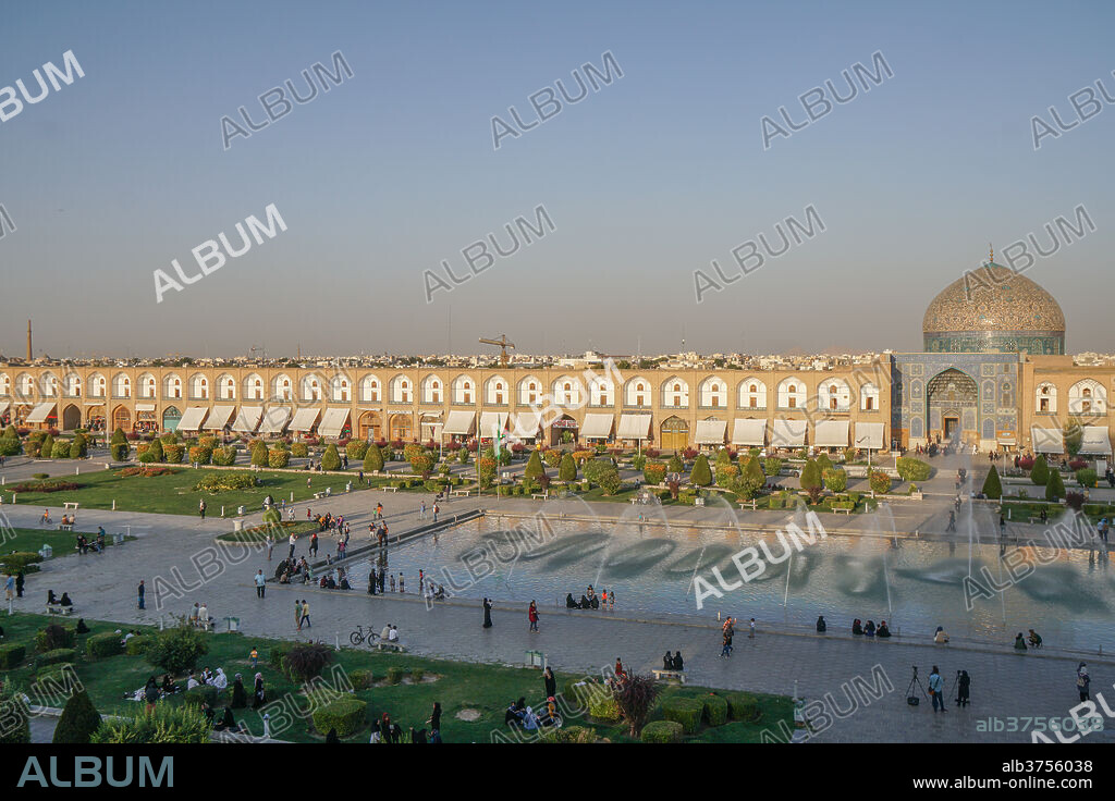 View across Naqsh-e (Imam) Square, UNESCO World Heritage Site, from Ali Qapu Palace opposite Sheikh Lotfollah Mosque, Isfahan, Iran, Middle East.
