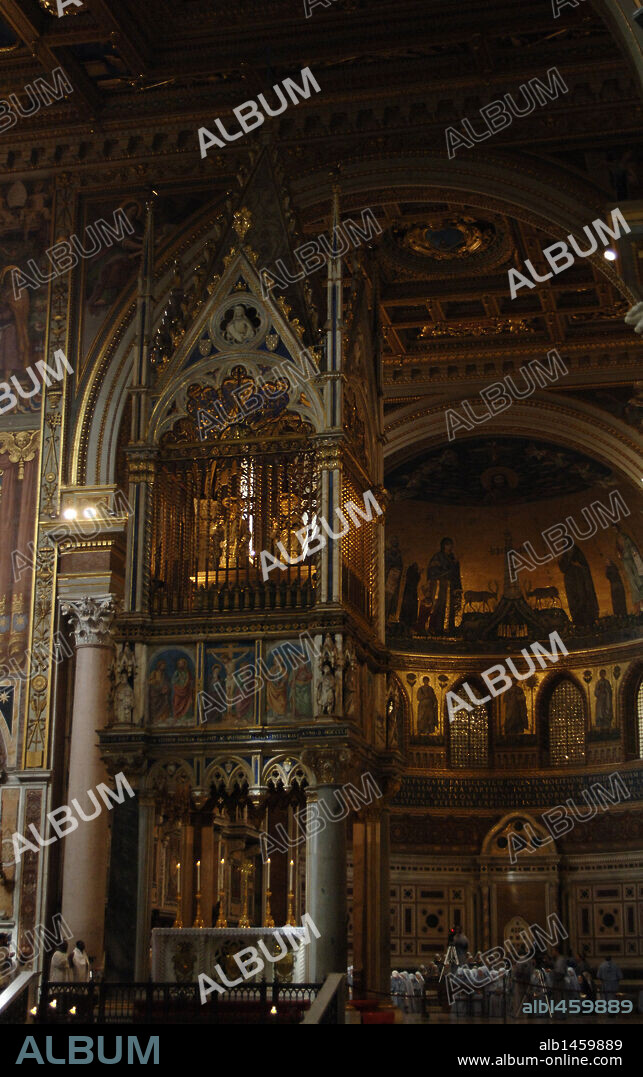 Religious celebration inside the Archbasilica of St. John Lateran (San Giovanni Laterano). First, the 14th century Gothic baldacchino. Rome. Italy.