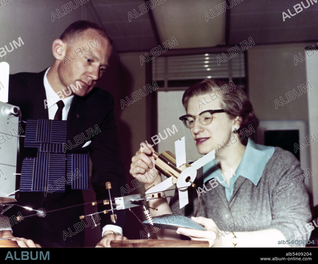 Roman explains the Advanced Orbiting Solar Observatory to astronaut Buzz Aldrin, 1965. Nancy Grace Roman (born May 16, 1925) is an American astronomer. She received her PhD in astronomy from the University of Chicago in 1949. In 1959, she joined NASA and in 1960 served as Chief of the Astronomy and Relativity Programs in the Office of Space Science. Roman was very influential in creating satellites such as the Cosmic Background Explorer (COBE) and the Hubble Space Telescope (HST). She retired from NASA in 1979, but continued working as a contractor at the Goddard Space Flight Center. Throughout her career, Dr. Roman was a spokesperson and advocate of women in the sciences.