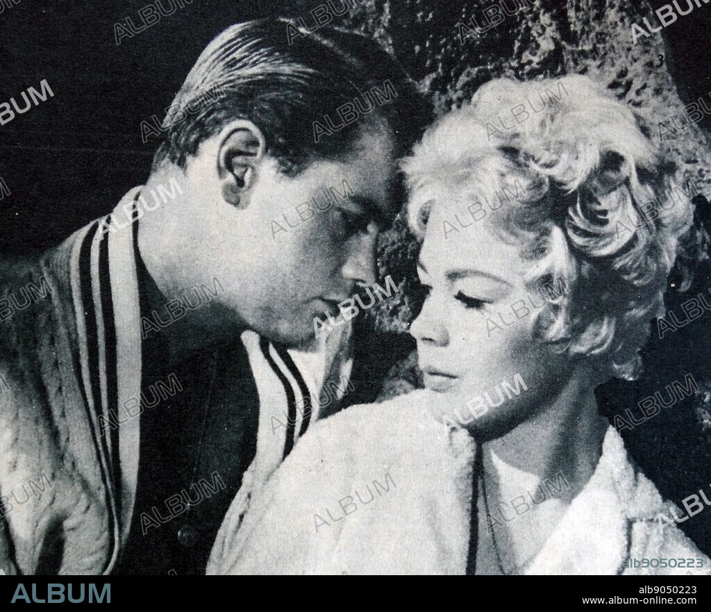 Sandra Dee and Troy Donaghue in A Summer Place, a 1959 American romantic drama film based on Sloan Wilson's 1958 novel of the same name. Sandra Dee (born Alexandra Zuck; April 23, 1942 - February 20, 2005) was an American actress. Dee began her career as a child model, working first in commercials, and then film in her teenage years. Troy Donahue (born Merle Johnson Jr., January 27, 1936 - September 2, 2001) was an American film and television actor and singer. He was a popular sex symbol in the 1950s and 1960s.