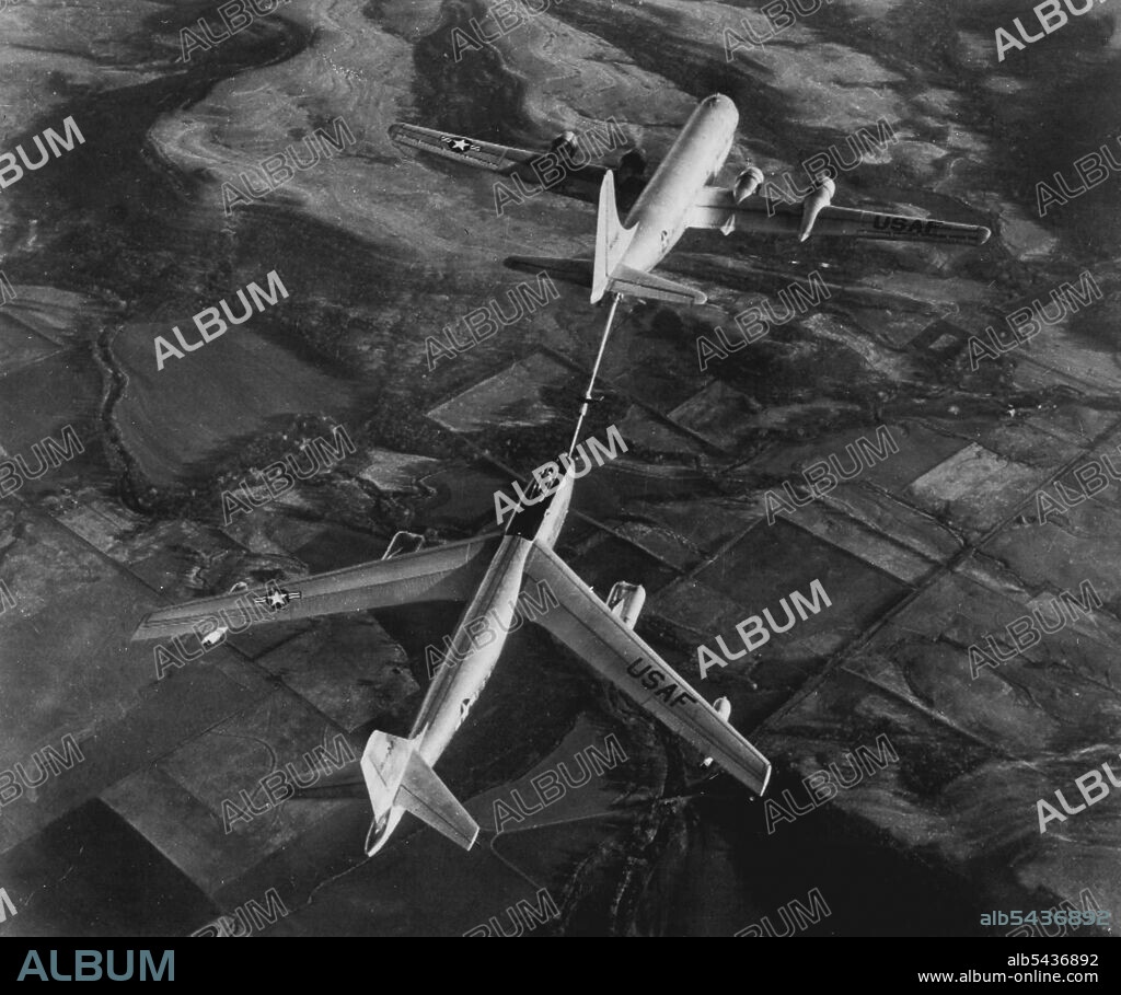 Fastest Jet Bomber Tanked Up In Air -- Here's the first released picture of the world's fastest bombers, a six-jet, 600-mile an-hour Boeing B-47 stratojet bomber, (bottom) being refueled from a double-deck Boeing KC-97A tanker plane. In this method of refueling, now a standard U.S. Air Force practice, fuel boom form under tail of tanker plane is connected with coupling in nose of bomber and the fuel is pumped in at high speed. June 18, 1951. (Photo by AP Wirephoto).