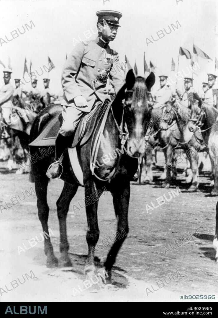 Emperor Hirohito of Japan on horseback, reviewing troops of the Japanese Army 1928.