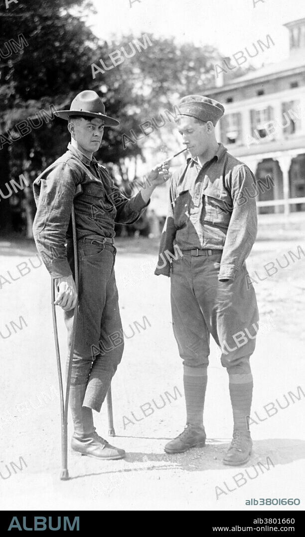 At Walter Reed Hospital, a soldier who is missing a foot lights a cigarette for another soldier who is missing both arms. Before WWI the hospital's capacity was 80 patient beds. But during the war it grew to 2,500 in a matter of months. When a soldier was hit by a bullet (soft lead ball) it flattened, causing terrible injuries, shattering bone, and tearing off large chunks of flesh. There were no antibiotics, no way to fight infection except removing a limb before gangrene set in. In traumatic amputations, the limb was simply cut across and the bone trimmed. There was no sanitation and the doctors reused tools without even washing them.