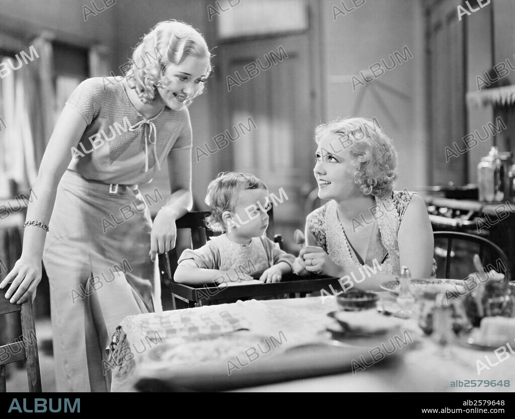 ANITA PAGE and MARIAN MARSH in UNDER 18, 1931, directed by ARCHIE MAYO. Copyright WARNER BROS PICTURES.