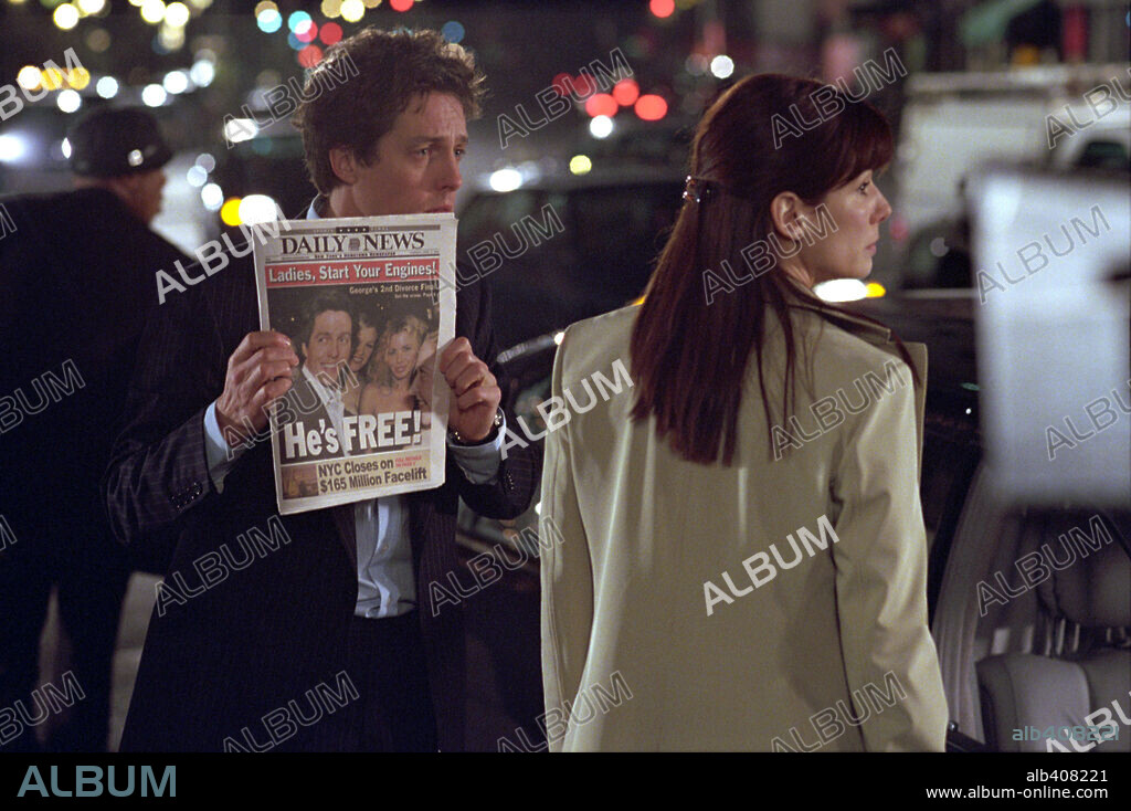 HUGH GRANT and SANDRA BULLOCK in TWO WEEKS NOTICE, 2002, directed by MARC LAWRENCE. Copyright WARNER BROS. PICTURES.