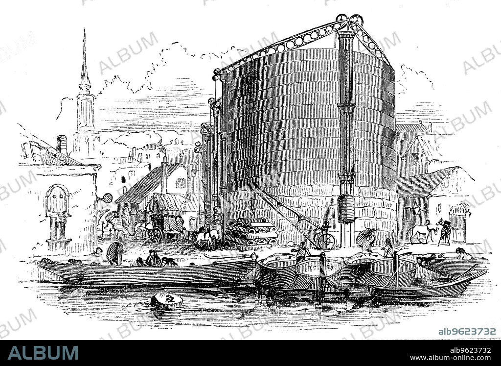 General exterior view of City of London Gasworks, showing gasometers and coal barges moored at the quay, 1876. Wood engraving.