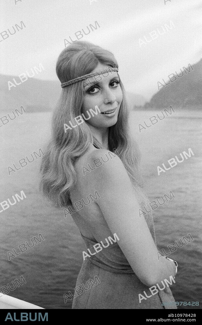 Austrian actress Gaby Fuchs by a lake in Austria, around 1972.