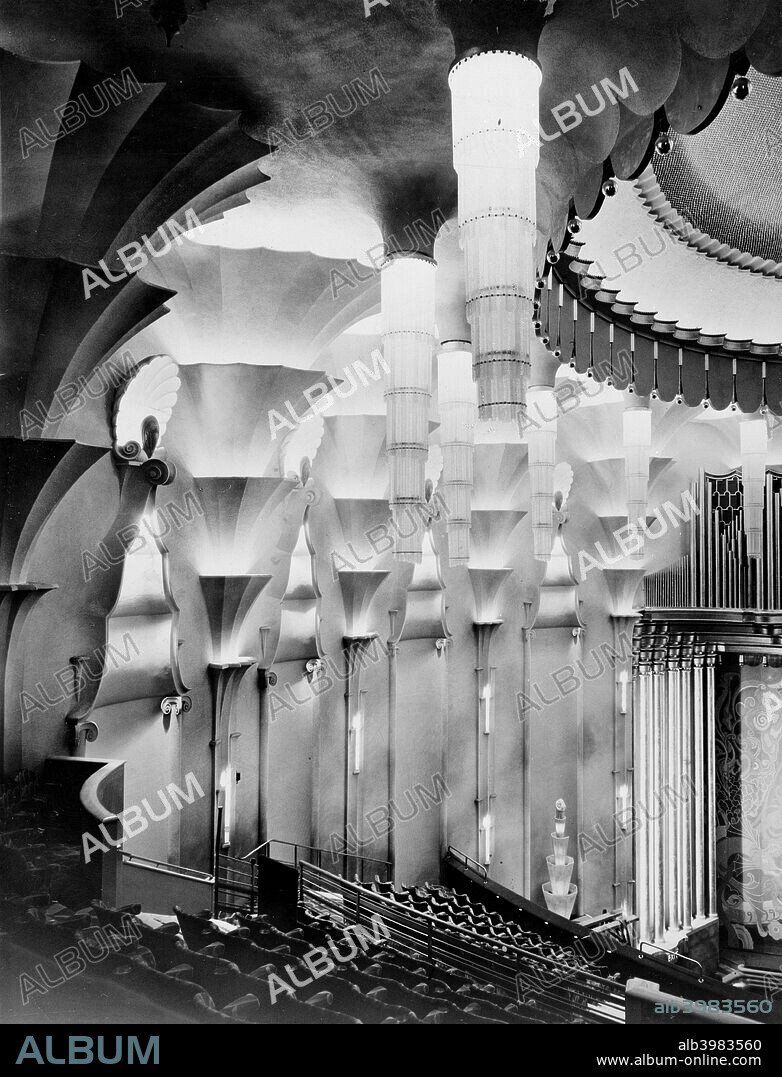 The auditorium of the New Victoria Cinema in Vauxhall Bridge Road, London, 1929; showing the ornate wall and pendant lights in the Art Deco style. The cinema was built in 1929 by Trent & Lewis.