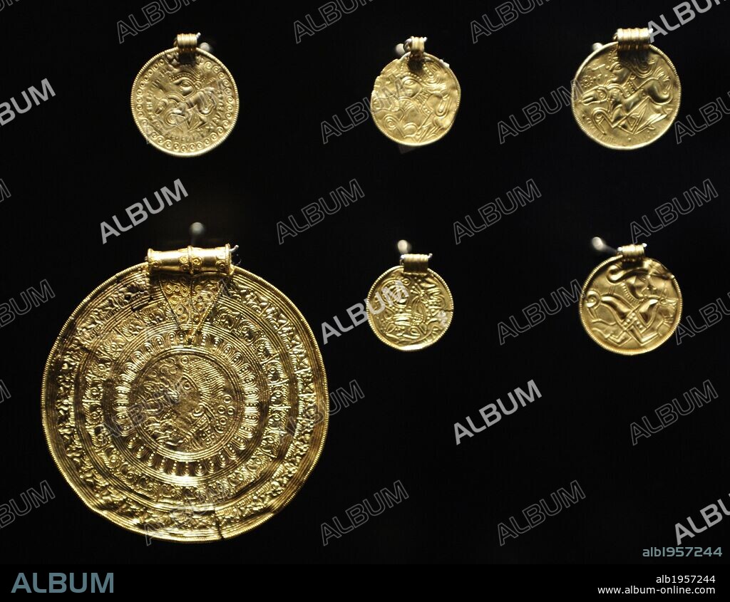 The gold bracteates. Flat, thin and single-sided gold medal worn as jewelry that was produced in Northern Europe predominantly during the Migration Period of the Germanic Iron Age. Appeared in Scandinavia around 450 and were used in the 6th century. National Museum of Denmark.