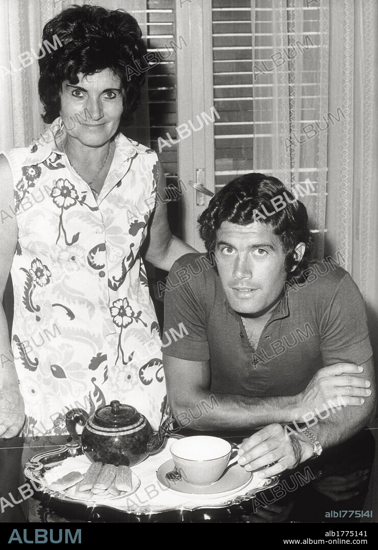 Giacomo Agostini and his mother Maria Vittoria. The Italian motorbike racer Giacomo Agostini and his mother Maria Vittoria while he is having a coffee. Bergamo province.