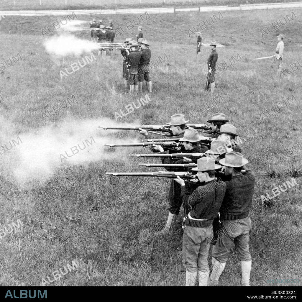 Entitled: "Company K 28th Regiment U.S. Infantry. Firing by squads at Camp Meade." The Philippine-American War (1899-1902) was an armed conflict between the United States and Philippine revolutionaries. The conflict arose from the struggle of the First Philippine Republic to secure independence from the United States following the latter's acquisition of the Philippines from Spain after the Spanish-American War. The war was a continuation of the Philippine struggle for independence that began in 1896 with the Philippine Revolution. Fighting erupted between United States and Philippine revolutionary forces on February 4, 1899, and quickly escalated into the 1899 Second Battle of Manila. On June 2, 1899, the First Philippine Republic officially declared war against the United States. The war officially ended on July 4, 1902. The war and occupation by the U.S. would change the cultural landscape of the islands, as people dealt with an estimated 34,000 to 220,000 Philippine casualties (with more civilians dying from disease and hunger brought about by war), disestablishment of the Roman Catholic Church in the Philippines, and the introduction of the English language in the islands as the primary language of government, education, business, industrial and increasingly in future decades among families and educated individuals. Photographed by Underwood & Underwood, 1899.