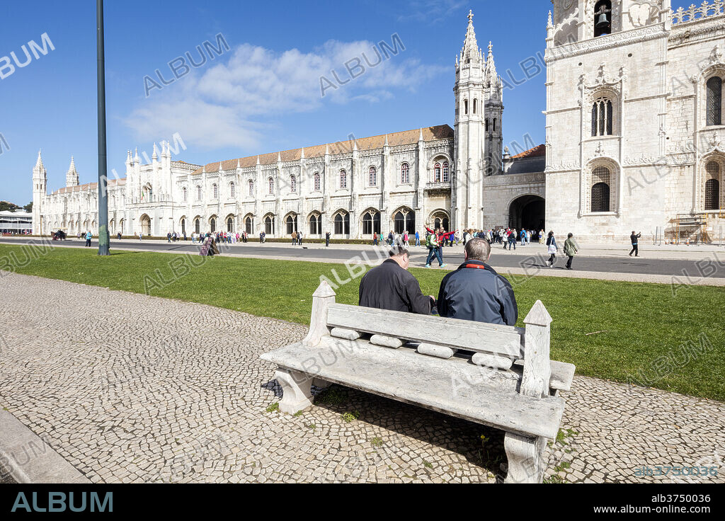 Tourists admire the late Gothic architecture of the Jeronimos Monastery, UNESCO World Heritage Site, Santa Maria de Belem, Lisbon, Portugal, Europe.