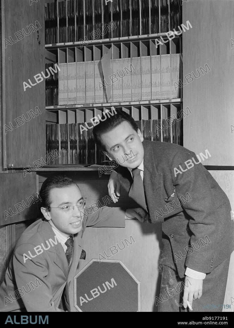 WILLIAM PAUL GOTTLIEB. Portrait of Ahmet M. Ertegun and Nesuhi Ertegun, Turkish Embassy (record room), Washington, D.C., 1930.