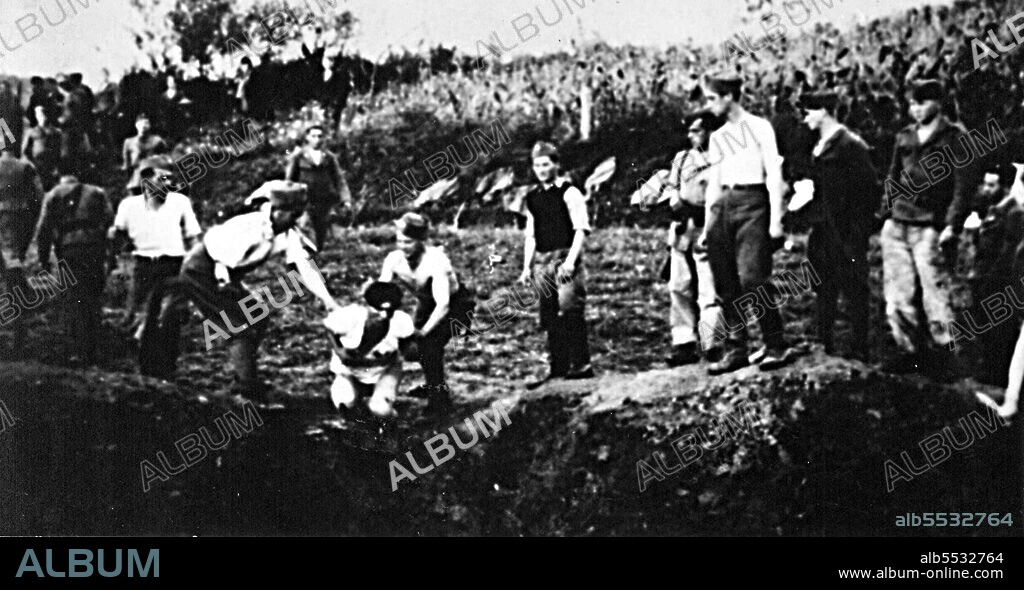 Ustasa militia execute prisoners near the Jasenovac concentration camp. The Ustasa (Croatian Revolutionary Movement) or Ustase was a Croatian fascist organization, between 1929 and 1945. Jasenovac was a concentration and extermination camp established in occupied Yugoslavia during World War II.