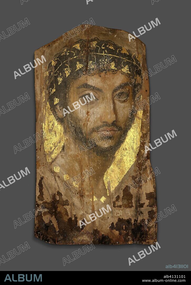 ANCIENT EGYPTIAN. Mummy Portrait of a Man Wearing an Ivy Wreath. Roman. Date: 101 AD-150 AD. Dimensions: 39.4 × 22 × 0.2 cm (15 1/2 × 8 5/8 × 1/16 in.), depth with support 3.5 cm (1 3/8 in.). Lime (linden) wood, beeswax, pigments, gold, textile, and natural resin. Origin: Fayum.