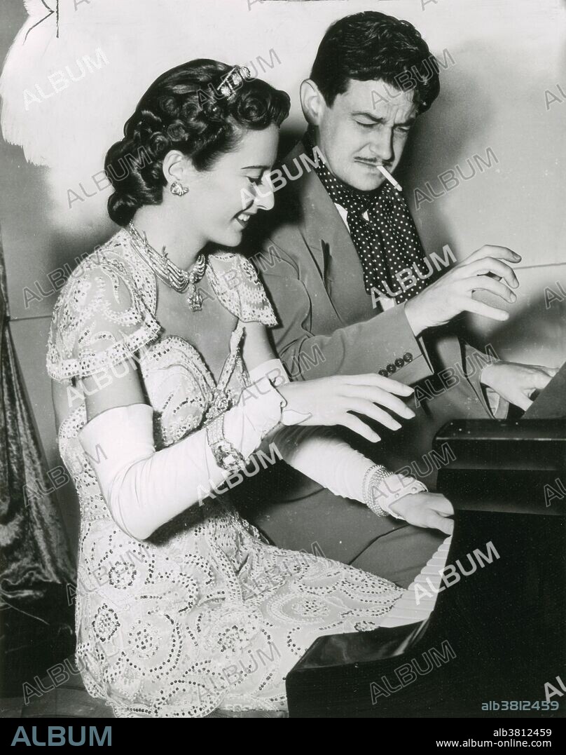 Stanwyck and Sturges taking a break on the set of "The Lady Eve", 1941. Barbara Stanwyck (July 16, 1907 - January 20, 1990) was an American actress. Orphaned at the age of four and partially raised in foster homes, by 1944 Stanwyck had become the highest-paid woman in the United States. She was nominated for the Academy Award for Best Actress four times and won three Emmy Awards. She received an Honorary Oscar at the 1982 Academy Award ceremony and the Golden Globe Cecil B. DeMille Award in 1986. She died in 1990 of congestive heart failure and chronic obstructive pulmonary disease at the age of 82. Preston Sturges (August 29, 1898 - August 6, 1959) was an American playwright, screenwriter, and film director. He took the screwball comedy format of the 1930s to another level, writing dialogue that, heard today, is often surprisingly naturalistic, mature, and ahead of its time, despite the farcical situations. He is often regarded as the first Hollywood figure to establish success as a screenwriter and then move into directing his own scripts, at a time when those roles were separate. In 1941, he won the Academy Award for Best Original Screenplay for the film The Great McGinty, his first of three nominations in the category. He died in 1959 at the age of 60 of a heart attack at the Algonquin Hotel while writing his autobiography (which, ironically, he'd intended to title The Events Leading Up to My Death).