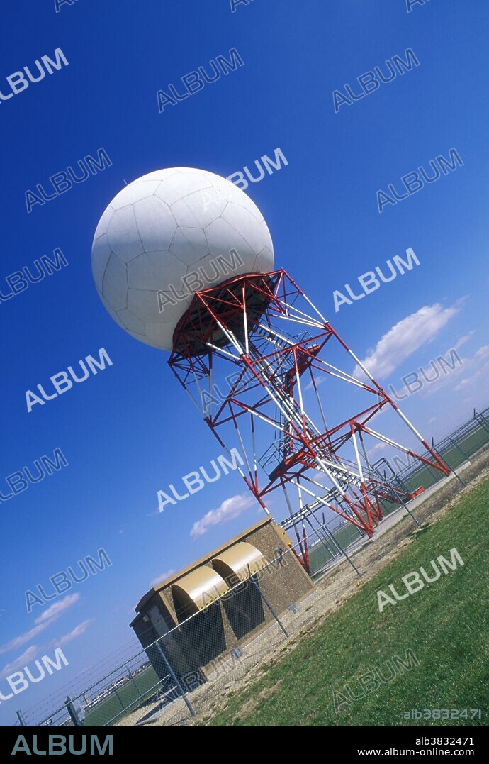Weather radar. Doppler radar dome (model WSR-88D) for weather forecasting. This technology allows forecasters to understand changes in the weather and to predict what will happen in the near future. Radio waves emitted from an antenna are scattered or reflected from atmospheric phenomena such as rain drops, snow crystals or hail pellets. The returning radio waves are received by the geodesic dome and are converted electronically into pictures showing the location and movement of weather systems. The direction and speed of wind can be derived from changes in frequency of the radio waves. Photographed at the National Weather Service in Wichita, Kansas, USA.