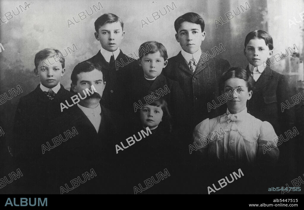 General Eisenhower As A Boy -- Dwight David Eisenhower, aged 12, third of six sons of David J. and Ida Elizabeth (nee Stover) Eisenhower pose for a family group of the Daguerre type, in 1902. Serious-faced young David is seen on the outside left - a position he soon changed to "Center field" when he took up baseball. His father (whose family had been in America since 1730) was, in turn, farmer, engineer, ice-maker. - In the centre, foreground, is Milton Stover Eisenhower, aged 3 when this picture was taken; he is now President of the Kansas State College, and was, unitl 1943, Associated Director of the American office of War Information. - Picture was taken at Abilene, Kansas, where the General spent his boyhood. He was bor 14.X1890, at Dennison, Tex. December 13, 1945. (Photo by Pictorial Press).