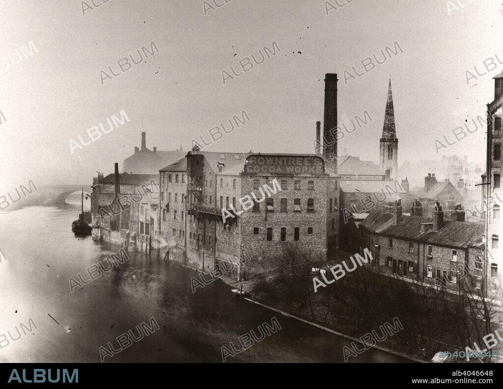 The Rowntree?s Cocoa Works Factory, North Street, overlooking the river Ouse, York, Yorkshire, 1890. The photograph is taken from Lendal bridge. The spire of All Saint?s, North Street can be seen to the right of the factory chimney.