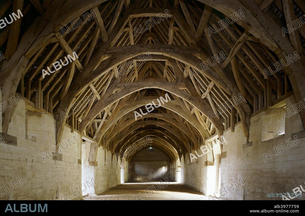 Interior of Bradford-on-Avon Tithe Barn, Wiltshire, c2000s(?). A 14th century building with a timber cruck roof, the barn was part of a medieval farmstead belonging to Shaftesbury Abbey.