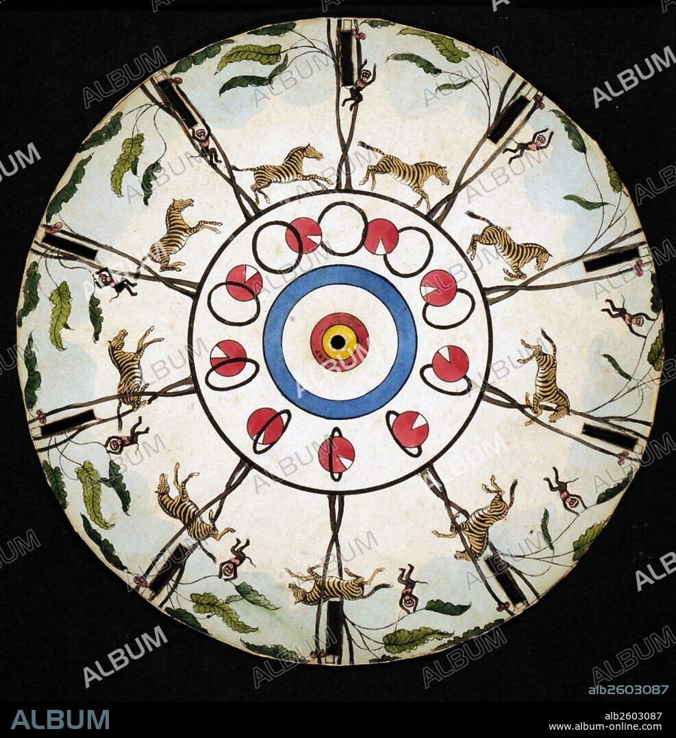 The Desert' Optical illusion disc which is spun displaying the illusion of motion of a ball with a wedge-shaped piece missing passing through a hoop and of a monkey swinging on branches of a tree and a zebra jumping through an opening between two trees in a circle at the outer edge of the disc.