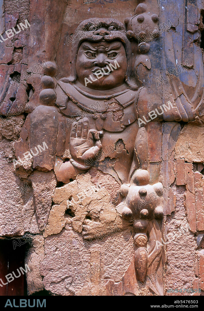 Maijishan Shiku (Maiji Shan Grottoes) are one of China’s four most important Buddhist temple groups (the others being Datong, Luoyang, and the Mogao Caves at Dunhuang). Starting from the Northern Wei (386-535) and Northern Zhou (557-81) Dynasties, Buddhists cut caves into the sides of a red outcrop rising from the surrounding foliage-covered hills. Figures of the Buddha, of bodhisattvas and disciples were carved in harder rock brought from elsewhere, and installed in the caves. At their height, the Maijishan caves are believed to have numbered almost 800, but they suffered serious damage during an earthquake in 734. This event, combined with the exigencies of time, has reduced the number of extant caves to 194. The existing rock cut architecture contains over 7,200 Buddhist sculptures and over 1,000 square meters of murals. Maiji Shan translates literally as 'Wheatstack Mountain'.