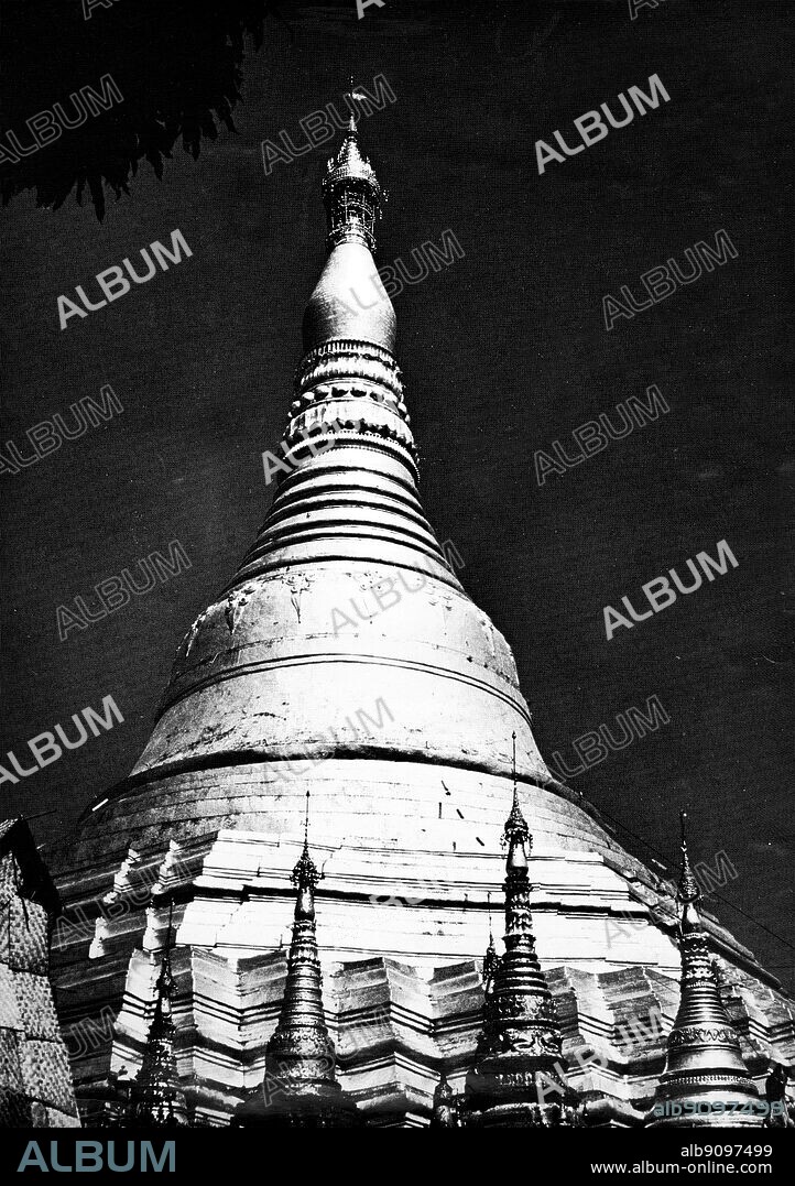 The Shawa Dragon Pagoda in Rangoon -. The majestic Shwedagon (Golden Dagon) Pagoda, Rangoon, Myanmar, dominates the Rangoon skyline from every vantage point. For Burmese Buddhists this is the most sacred of all sites in Myanmar, one which all Burmese aspire to visit at least once in their lifetimes. Legend has it that the Shwedagon was built to house 8 hairs of the Buddha; these rest in a chamber below a golden slab under the large golden stupa (dome). The golden stupa rises 98m and is solid in construction. It is believed to have been built by the Mon people between the 6th and 10th centuries, but has been rebuilt many times as a result of earthquakes, etc. ©TopFoto.