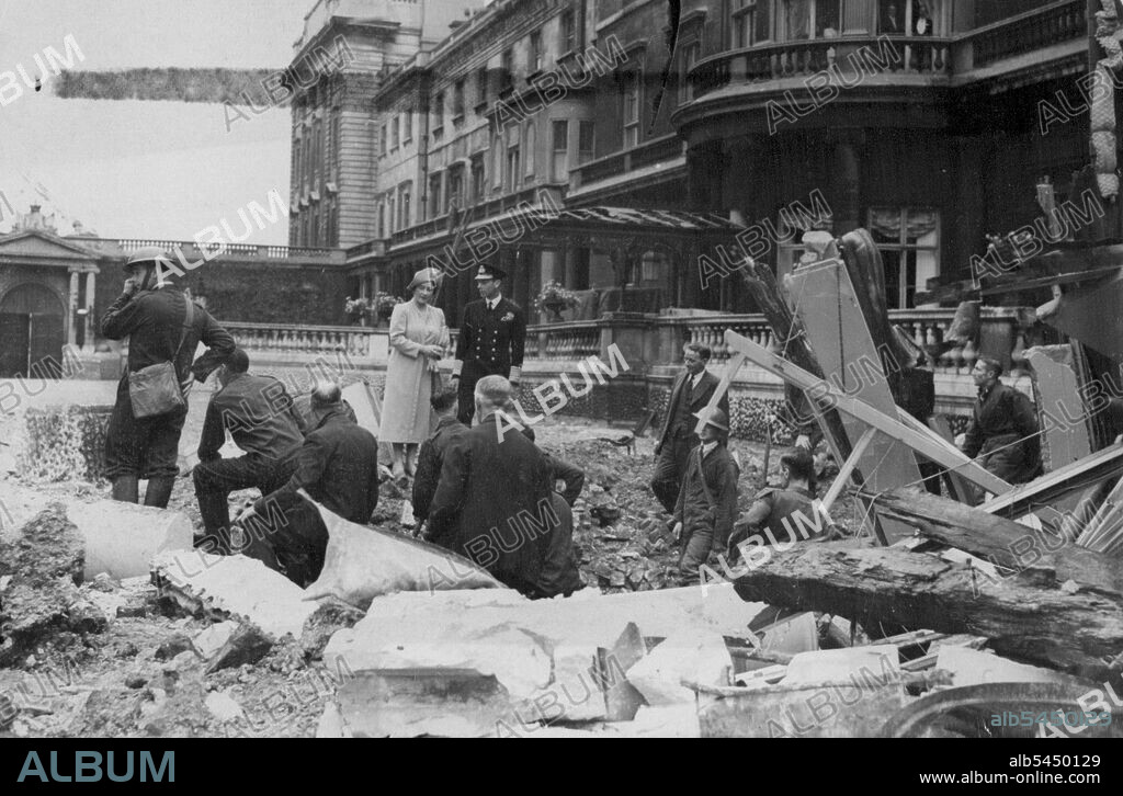 Nazi Raiders Bomb Buckingham Palace: King and Queen Inspect Damage.
The King and Queen inspect the damage done to Buckingham Palace by the explosion of a time bomb dropped by Nazi Raiders on Sunday night (Sept.8). Their Majesties, photographed today, Sept.11, Were not in the palace at the time of the Explosion and there no casualties. November 12, 1940. (Photo by Associated Press Photo).