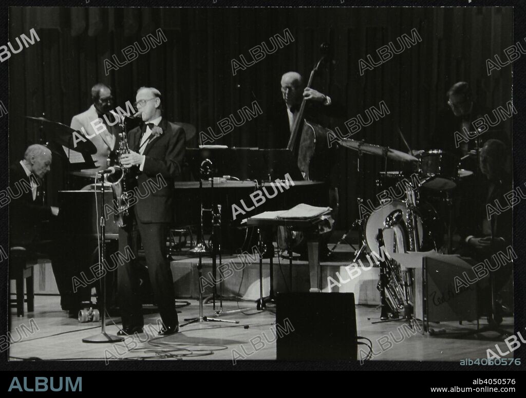 The Ted Heath Orchestra in concert, London, 1985. Norman Stenfalt (piano), Don Lusher (trombone), Tommy Whittle (saxophone), Lennie Bush (double bass) and Jack Parnell (drums) can be seen.