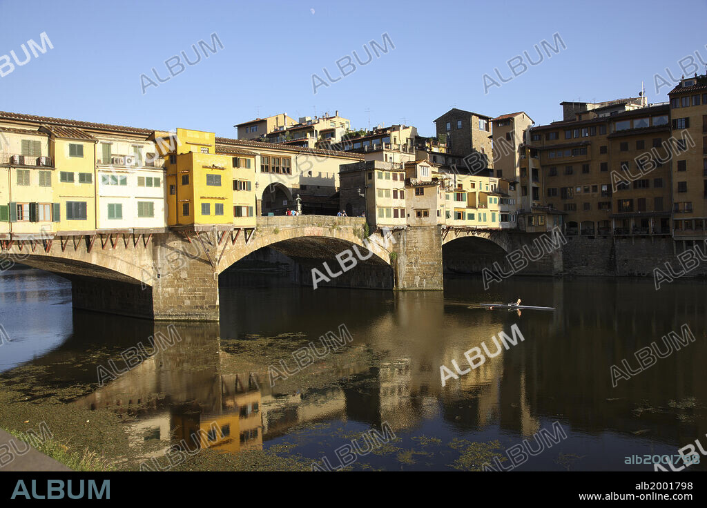 The Ponte Vecchio is the oldest bridge in Florence, and the only one that survived the Second World War. It stands on the site of at least three precedent bridges, the first of which goes back to Roman times. The current bridge was built in 1345 by Neri di Fioravante. It is an elegant structure with three arches, characterized by the small housed that line both sides of the bridge.