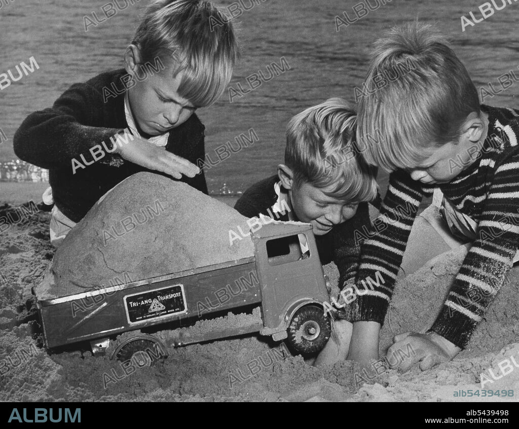 Six-year-old Paul King, of Seaforth, was in trouble at The Spit today when his truck bogged down with a load of sand aboard. After much deliberation Paul decided to Jettison. September 10, 1954.