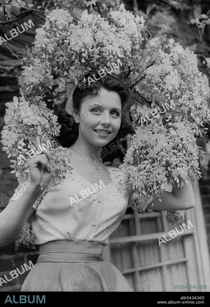 Sophisticated Sonja - an attractive portrait of 26-years-old German star Sonja Ziemann, whose first British film is "Made In Heaven". This artiste start in "Made In Heaven". In this original story by George H. Brown, screen play by William Douglas-Home, David Tomlinson, Petula Clark, Sonja Ziemann and A. E. Matthews are the stars, with Charles Victor and Sophie Stewart. Filmed in Technicolor at Pinewood Studios, 'Made In Heaven' was directed by John Paddy Carstairs and produced by George H. Brow.