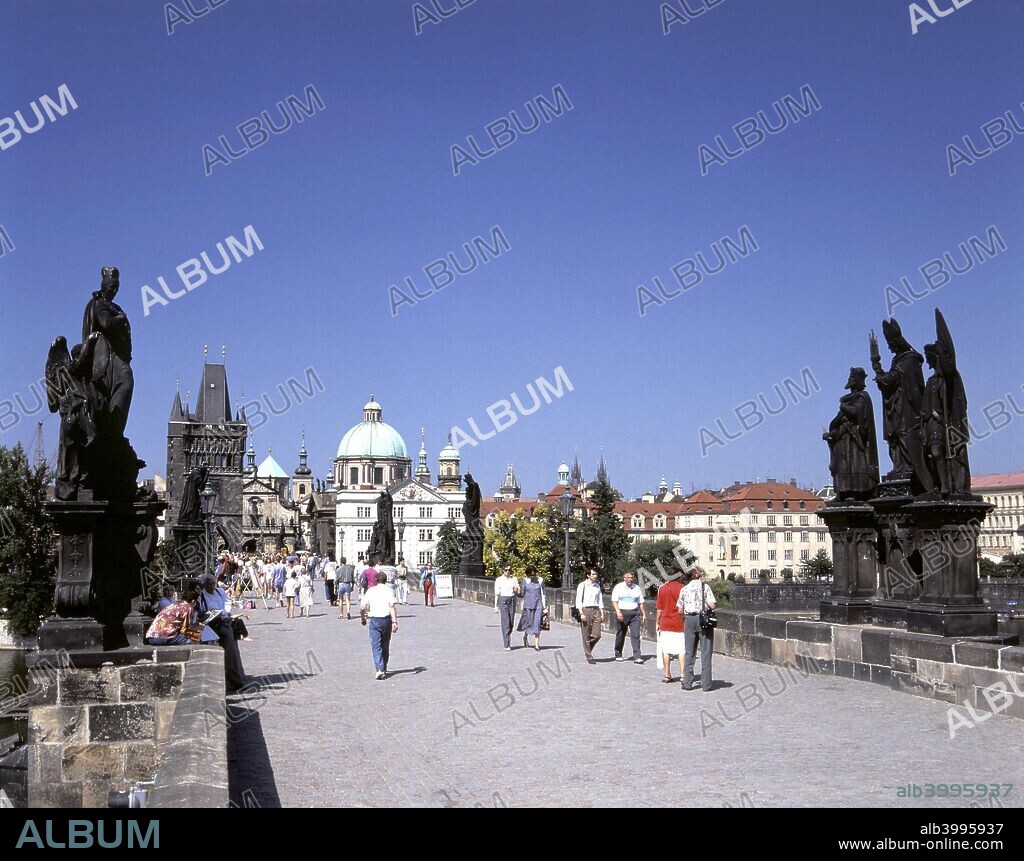 Charles Bridge, Prague, Czech Republic. The building of the Charles Bridge over the Vltava began in 1357 during the reign of Charles IV, King of Bohemia and Holy Roman Emperor. The bridge is built of stone, 516 metres long, and has 16 arches protected with ice guards. The rows of statues on either side of the bridge were added in c1700.