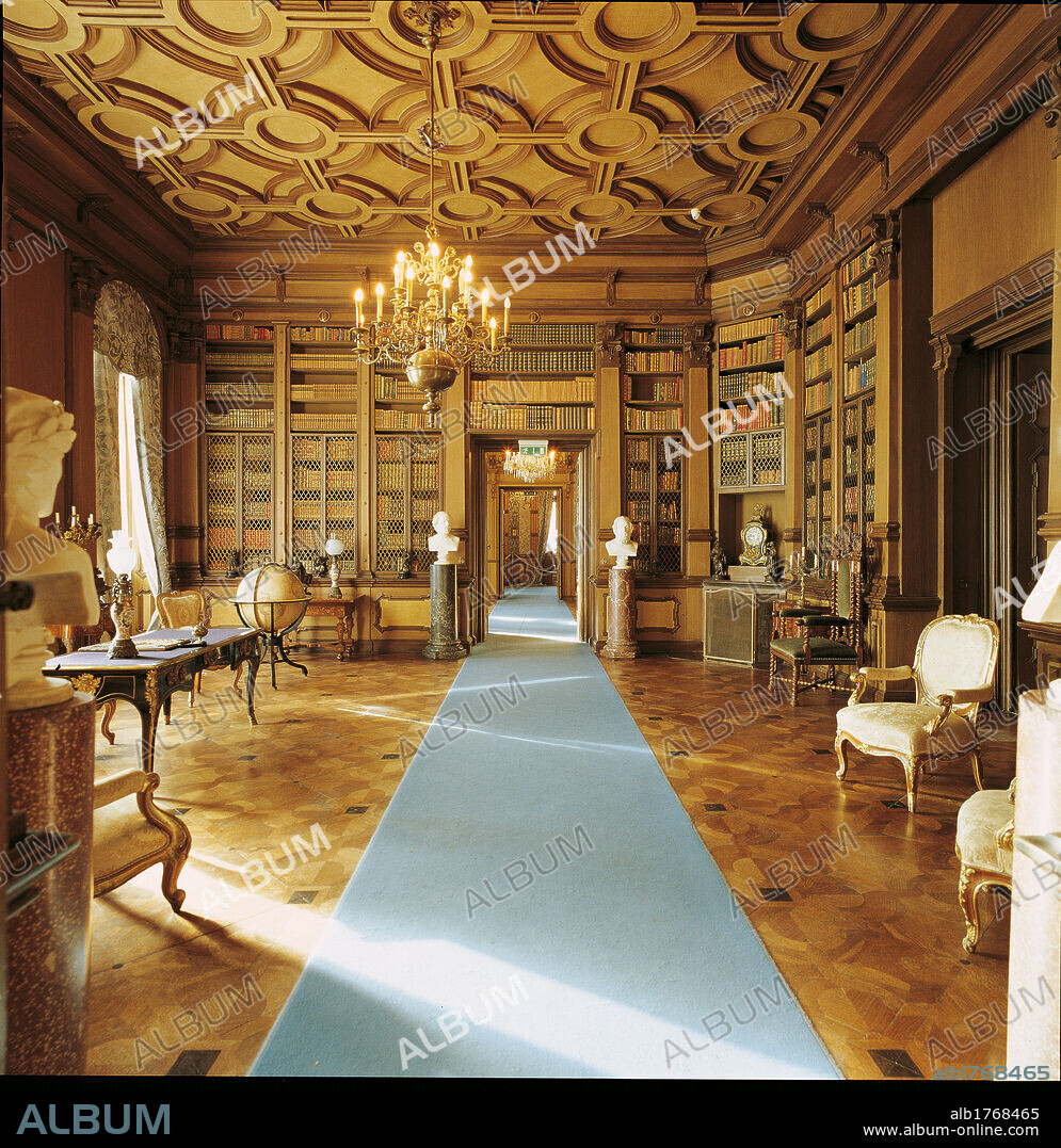 Castle and Park of Miramare, Trieste, by Julius Hofmann, Carl Junker, 1855 post, 19th Century, white Istrian stone,. Italy, Friuli Venezia Giulia, Trieste, Miramare Castle. Detail. Interior of Miramare Castle ground floor Room V Maximilian of Habsburgs Library marquetry ceiling wood paneling walls parquet floor armchairs bookshelves lamp. Authorization required for non editorial use.
