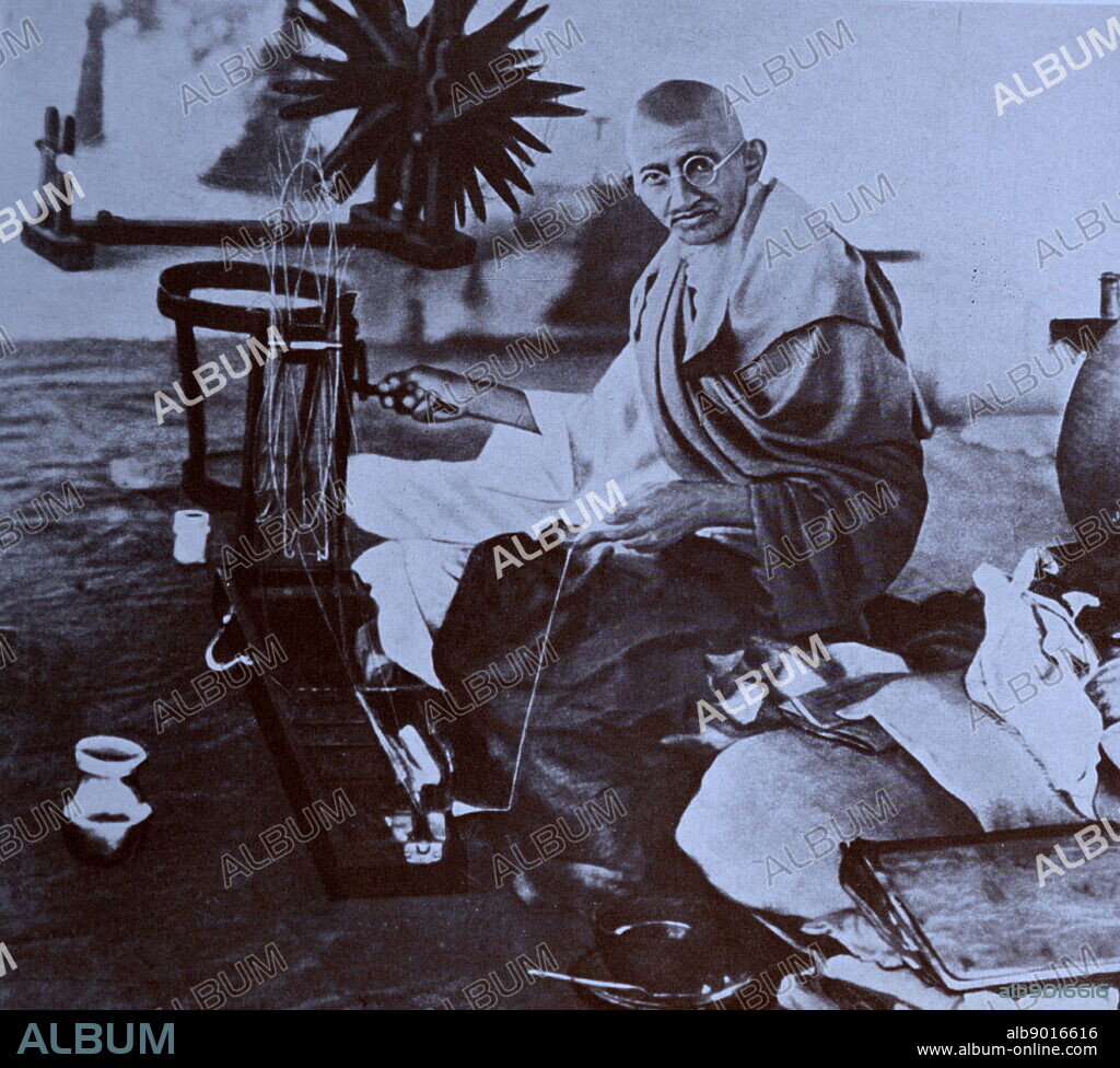 Mohandas Gandhi (1869 1948) was the preeminent leader of the Indian independence movement in British-ruled India. Seen here at a spinning wheel making home-spun cloth.