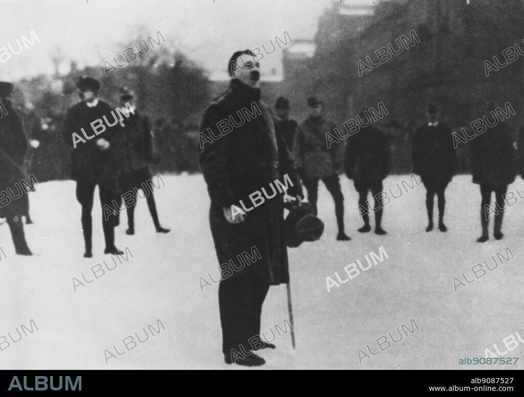 An unknown political agitator, Adolph Hitler speaks on a Munich street corner.